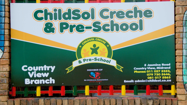 A sign on the gate of ChildSol